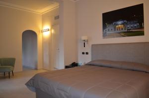 Postel nebo postele na pokoji v ubytování Grand Hotel Nizza Et Suisse