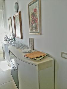 a room with a row of white washing machines at Antares Bed and Breakfast in Syracuse