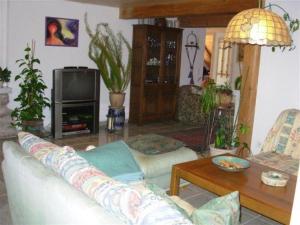 a living room with a couch and a table at Talblickhof in Sankt Georgen im Schwarzwald