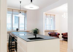 a kitchen with a island with a sink in it at Islandijos gatvė in Vilnius
