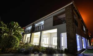 a building with lit up windows at night at Serurubele Boutique Hotel in Bushbuckridge
