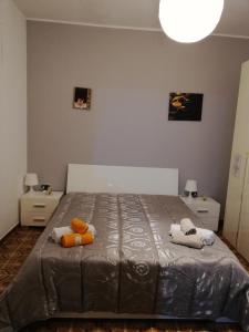 Łóżko lub łóżka w pokoju w obiekcie Casa Vacanze "Il Carruggio"