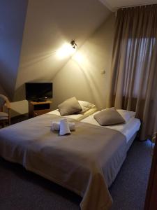 Postel nebo postele na pokoji v ubytování Małgosia - 10 minut na piechotę do stoku narciarskiego i basenów termalnych Bania