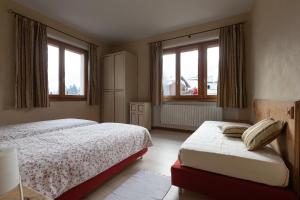 Posteľ alebo postele v izbe v ubytovaní Casa Melide 1