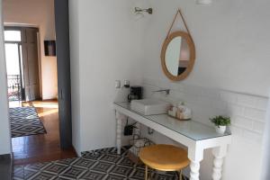 a bathroom with a white sink and a mirror at Markee Hotel Boutique Querétaro Centro Historico in Querétaro +96 photos