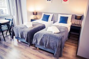 Ein Bett oder Betten in einem Zimmer der Unterkunft Apartamenty 21 Basic