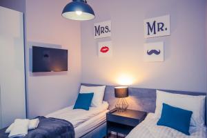Ein Bett oder Betten in einem Zimmer der Unterkunft Apartamenty 21 Basic