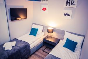 Ein Bett oder Betten in einem Zimmer der Unterkunft Apartamenty 21 Basic