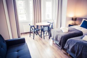 Ein Bett oder Betten in einem Zimmer der Unterkunft Apartamenty 21 Basic