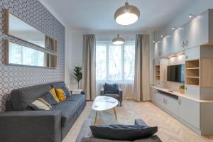 a living room with a couch and a table at Gálya Apartment in Budapest