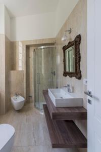 a bathroom with a sink and a shower and a toilet at Mediterraneo Emotional Hotel & Spa in Santa Margherita Ligure