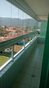 an empty building with a view of a large window at Residencial Bela Vista in Solemar