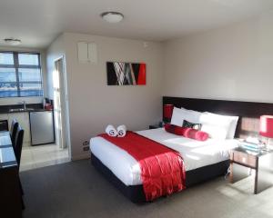 Voodi või voodid majutusasutuse Dunedin Palms Motel toas