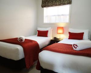 Voodi või voodid majutusasutuse Dunedin Palms Motel toas