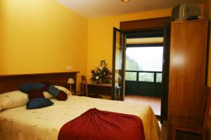 Postel nebo postele na pokoji v ubytování Hotel Restaurante Canero