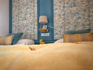 Una cama o camas en una habitación de Casa Secreta Vélez-Málaga centro