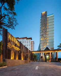 a view of a building with a tall building at The Astra Condo City Center Chiang Mai in Chiang Mai