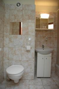 a bathroom with a toilet and a sink at Atlantic Hotel in Budapest