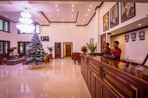 a christmas tree in the lobby of a salon at Cheathata CTS Hotel Siem Reap in Siem Reap