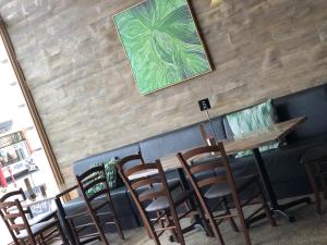 a dining room with a table and chairs at Bull and Mouth Hotel in Maryborough