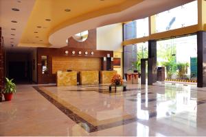 a lobby of a building with a large lobby at Gokulam Park Sabari-Siruseri SIPCOT in Chennai