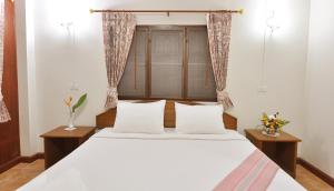 Postel nebo postele na pokoji v ubytování Mira Mare Resort Koh Samui