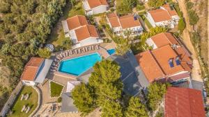 an overhead view of a house with a swimming pool at Coral Blue Beach Hotel Gerakini in Gerakini