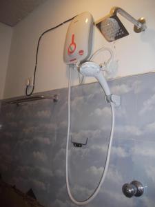 a shower in a bathroom with a shower head at Wishwa Villa in Weligama