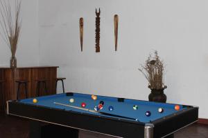 a pool table with balls in a room at Riviera Garden in Antananarivo