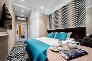 Łóżko lub łóżka w pokoju w obiekcie Hotel Arkadia Nova
