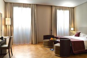 Кровать или кровати в номере Palazzo Esedra