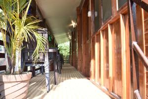 a hallway of a building with a potted plant at Club Palolem Resort in Palolem