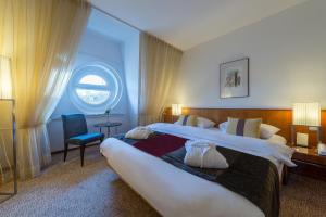 Posteľ alebo postele v izbe v ubytovaní K+K Hotel Opera