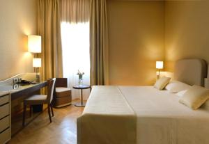 Кровать или кровати в номере Palazzo Esedra