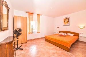 Postel nebo postele na pokoji v ubytování Apartments Salčinović