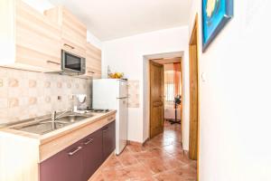 Kuchyň nebo kuchyňský kout v ubytování Apartments Salčinović