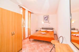 Postel nebo postele na pokoji v ubytování Apartments Salčinović
