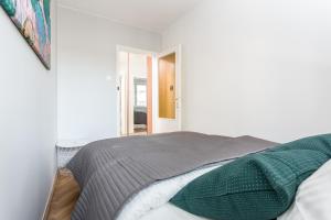 Posteľ alebo postele v izbe v ubytovaní Chill Apartments Pańska