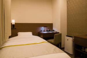 Postel nebo postele na pokoji v ubytování Tosei Hotel Cocone Ueno