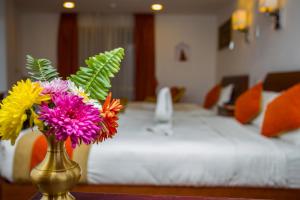 Ένα ή περισσότερα κρεβάτια σε δωμάτιο στο Apsara Boutique Hotel
