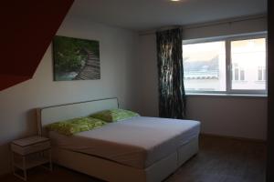 En eller flere senger på et rom på Rennweg Top Apartment
