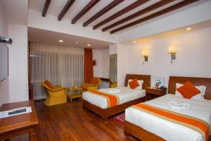 Ένα ή περισσότερα κρεβάτια σε δωμάτιο στο Apsara Boutique Hotel