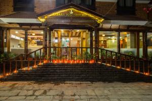 a set of stairs in front of a building with lights at Apsara Boutique Hotel in Kathmandu