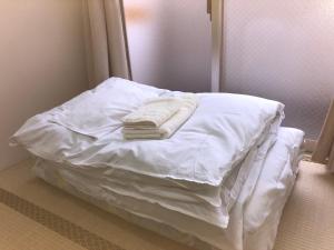 Postel nebo postele na pokoji v ubytování Hotel Mirai