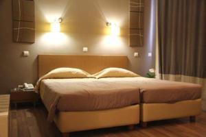 Postel nebo postele na pokoji v ubytování Ariston Hotel
