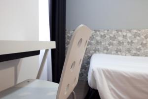 Posteľ alebo postele v izbe v ubytovaní Hostal Nitzs Bcn