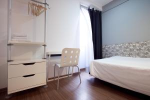 Posteľ alebo postele v izbe v ubytovaní Hostal Nitzs Bcn