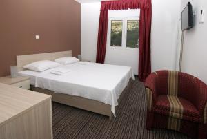 Postel nebo postele na pokoji v ubytování Hotel Belveder