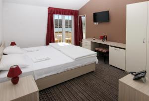 Postel nebo postele na pokoji v ubytování Hotel Belveder