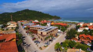 an aerial view of a town with the ocean at Pitaya Apart Hotel in Garopaba